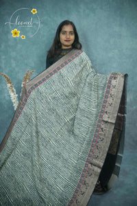 AJF1321 Off-White and Charcoal Grey Viscose saree with brush-stroke wavy pattern.