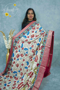 AJF1821 Cream Viscose saree features Kalamkari floral motifs with crimson Banarasi zari border.