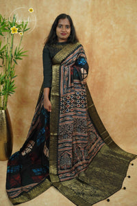 APL0002 Black with multi-colour earth tones viscose saree with Ajrakh prints and  gold Banarasi zari border with tassels.