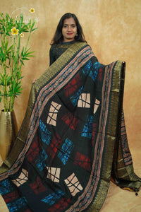 APL0002 Black with multi-colour earth tones viscose saree with Ajrakh prints and  gold Banarasi zari border with tassels.