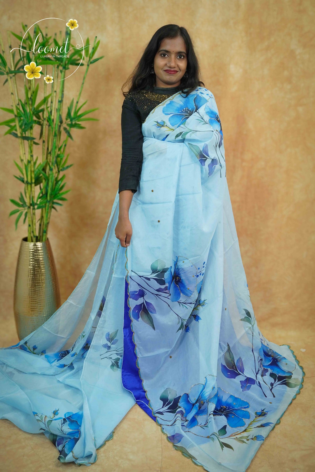 APL0201 Blue Semi Organza saree featuring digital floral printed with scalloped gold border.