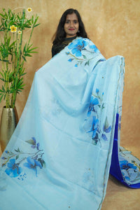 APL0201 Blue Semi Organza saree featuring digital floral printed with scalloped gold border.