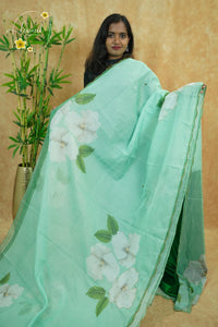 APL0203 Mint Green Semi Organza saree featuring digital floral printed with scalloped gold border.