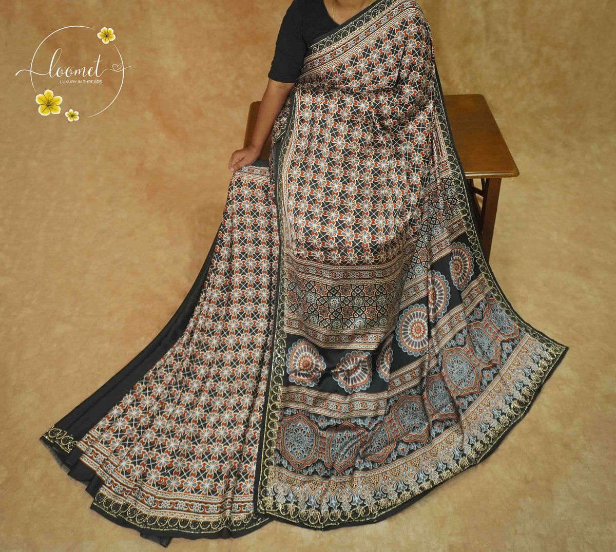 APL1024 Black Semi Modal Silk with ajrakh print geometric trellis and handcrafted gota embroidery.