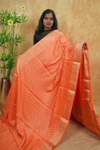 APL10702 Peach-Orange silky georgette saree with an all-over diamond (chowka) grid pattern.