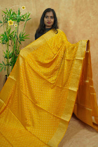 APL10704 Mustard Yellow silky georgette saree with an all-over diamond (chowka) grid pattern.