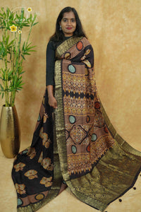APL1201 Black with multi-colour earth tones viscose saree with contemporary prints and gold banarasi zari border and tassels.