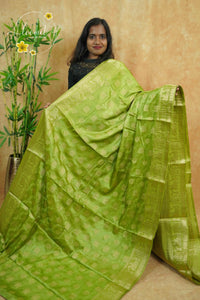 APL20003 Olive Green silky georgette saree with an all-over diamond (chowka) grid pattern.
