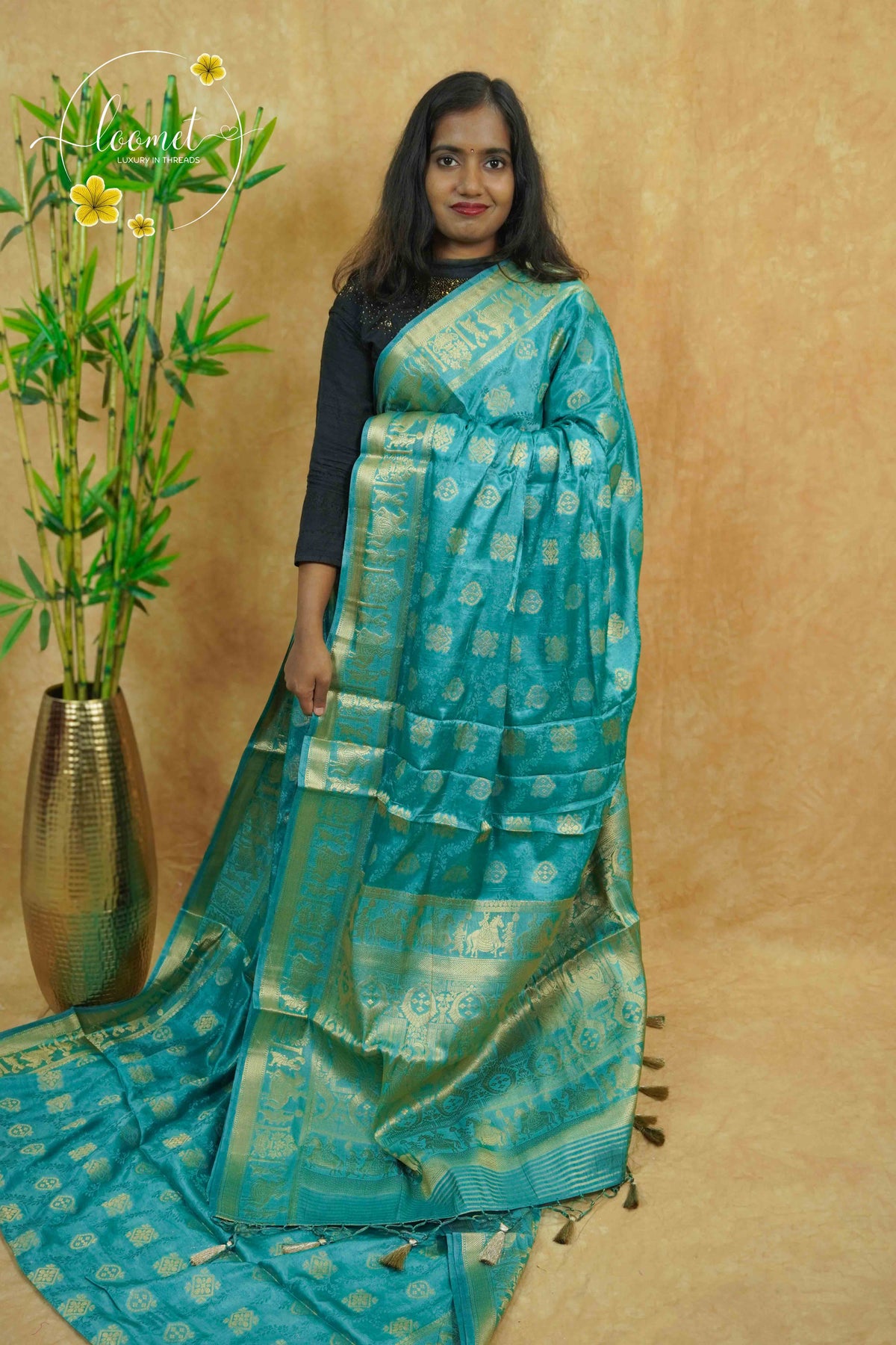 APL20005 Teal Blue silky georgette saree with an all-over diamond (chowka) grid pattern.