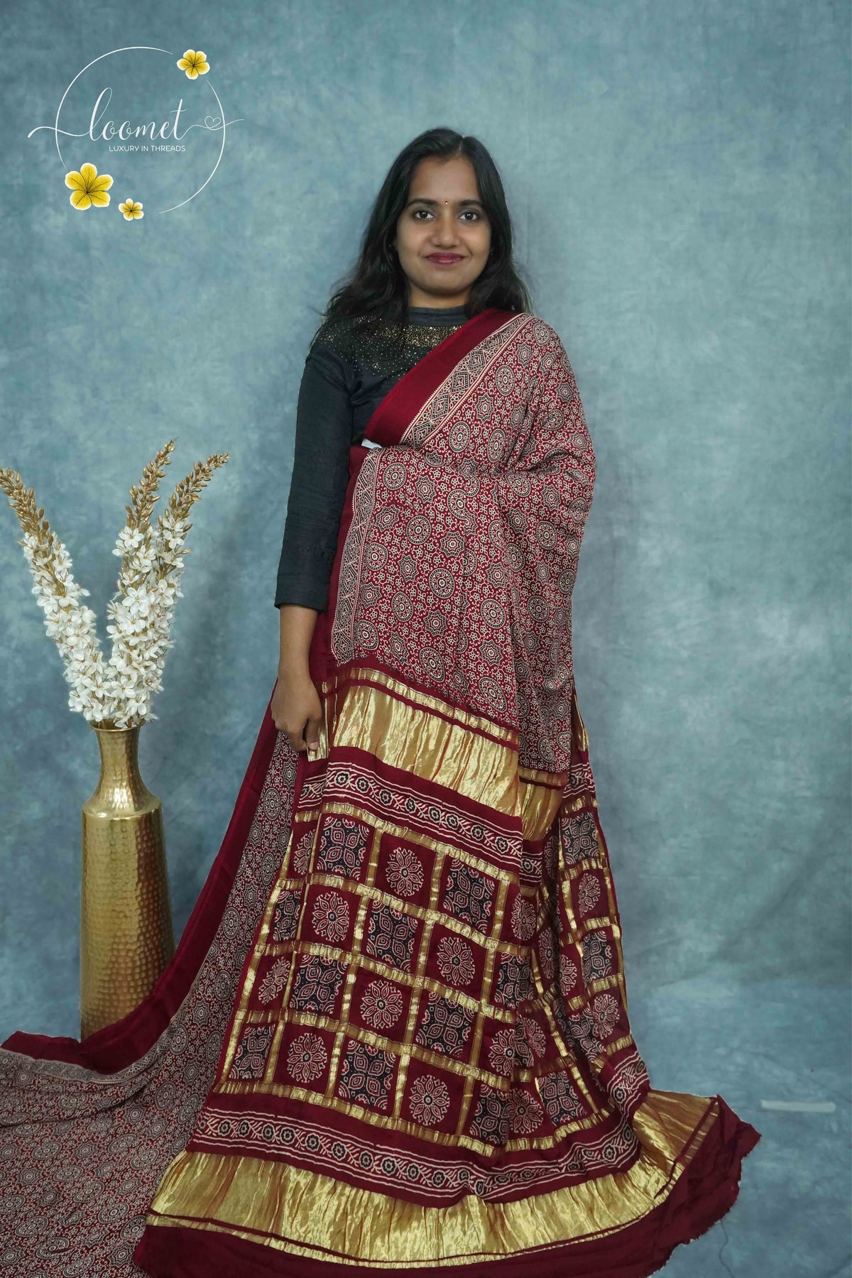 APL20301 Maroon Modal silk with kaleidoscopic patterns.