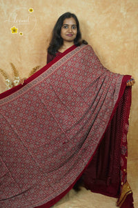 APL20301 Maroon Modal silk with kaleidoscopic patterns.