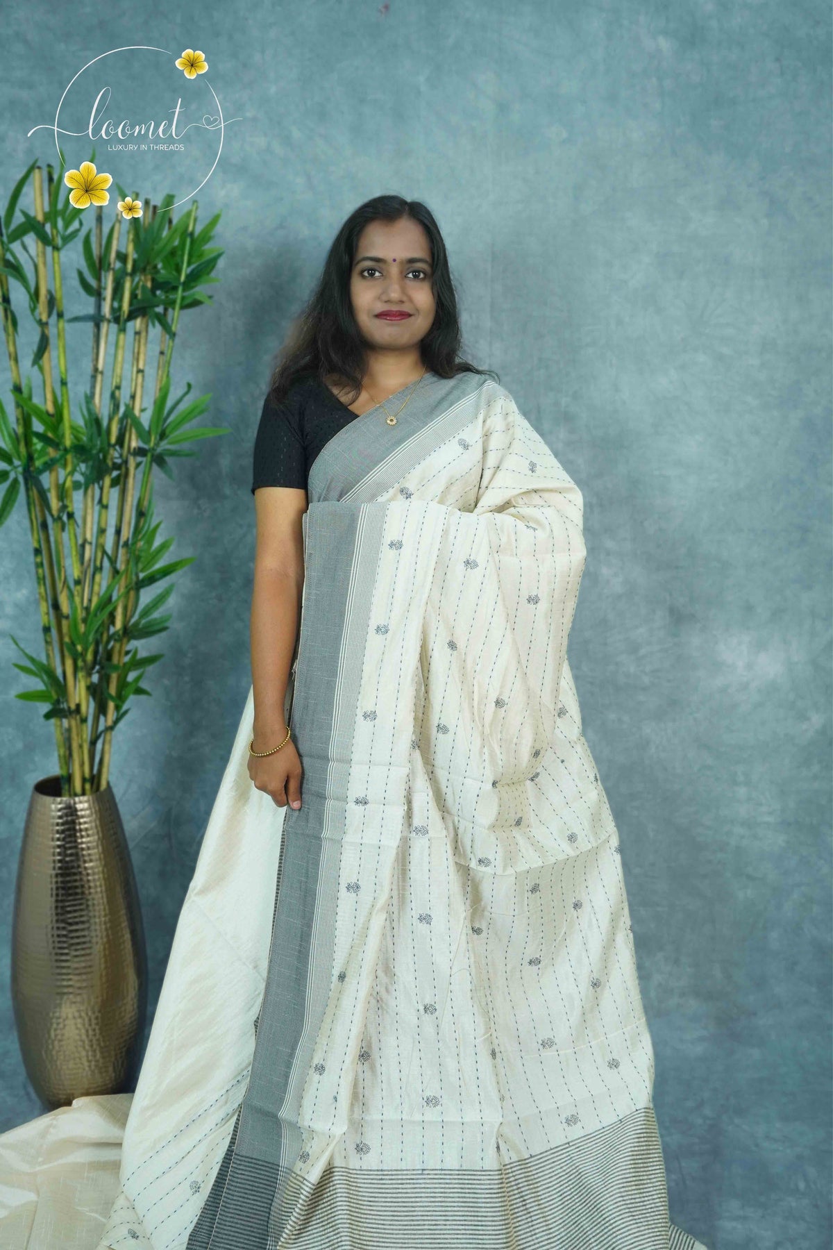 APL3102 Off-White Tussar silk saree with vertical dotted lines leafy buttas.