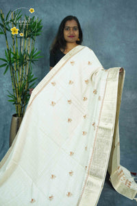 APL3203 Off-White Tussar Silk saree with orange-colored thread bird-on-a-branch motif.