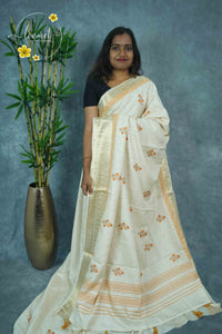 APL3302 Off-White Tussar Silk saree with orange and gold floral bunch buttas