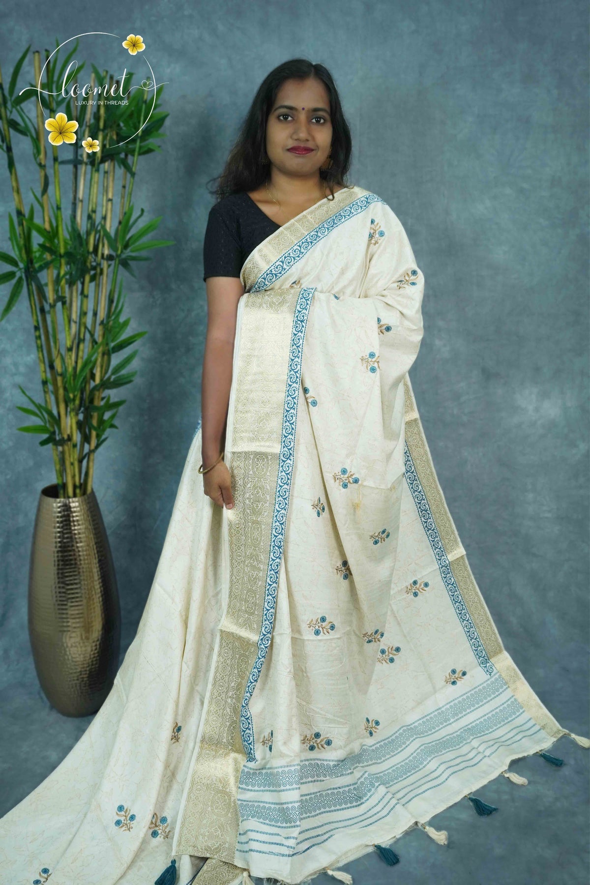 APL3303 Off-White Tussar Silk saree with peacock blue and gold floral bunch buttas