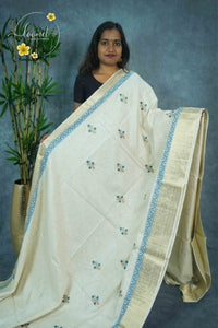 APL3303 Off-White Tussar Silk saree with peacock blue and gold floral bunch buttas
