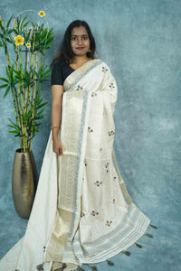 APL3304 Off-White Tussar Silk saree with peacock dark grey and gold floral bunch buttas