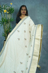 APL3304 Off-White Tussar Silk saree with peacock dark grey and gold floral bunch buttas