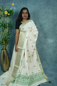 APL4502 Off-White Tussar Silk saree with mehendi green tree-of-life butis.