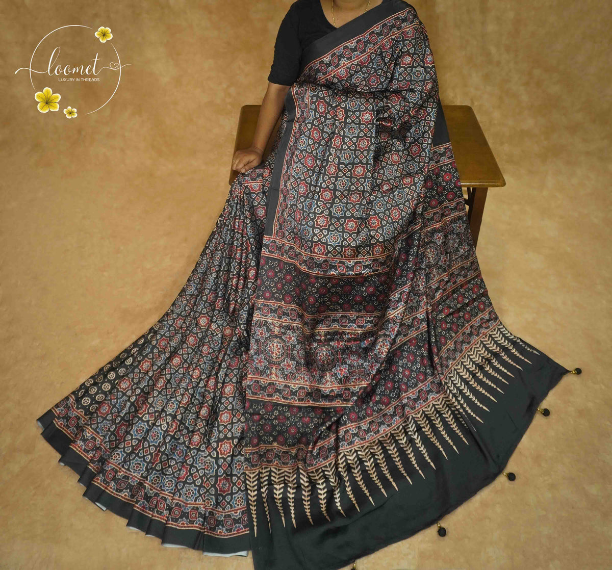 APL6122 Black Semi Modal Silk with ajrakh print geometric star medallions and spire pallu.