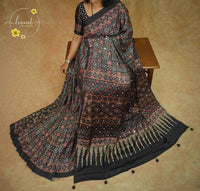 APL7121 Black Semi modal silk saree with ajrakh print and handcrafted mirror work.