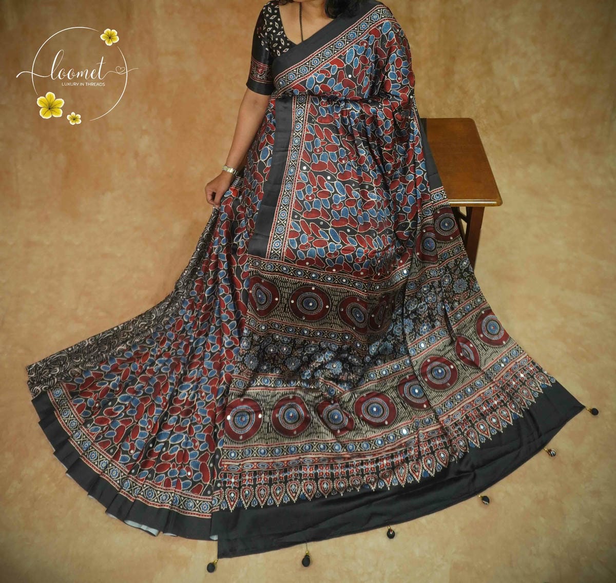 APL7123 Elegant black semi modal silk saree with red and blue Ajrakh prints and handcrafted Mirror work