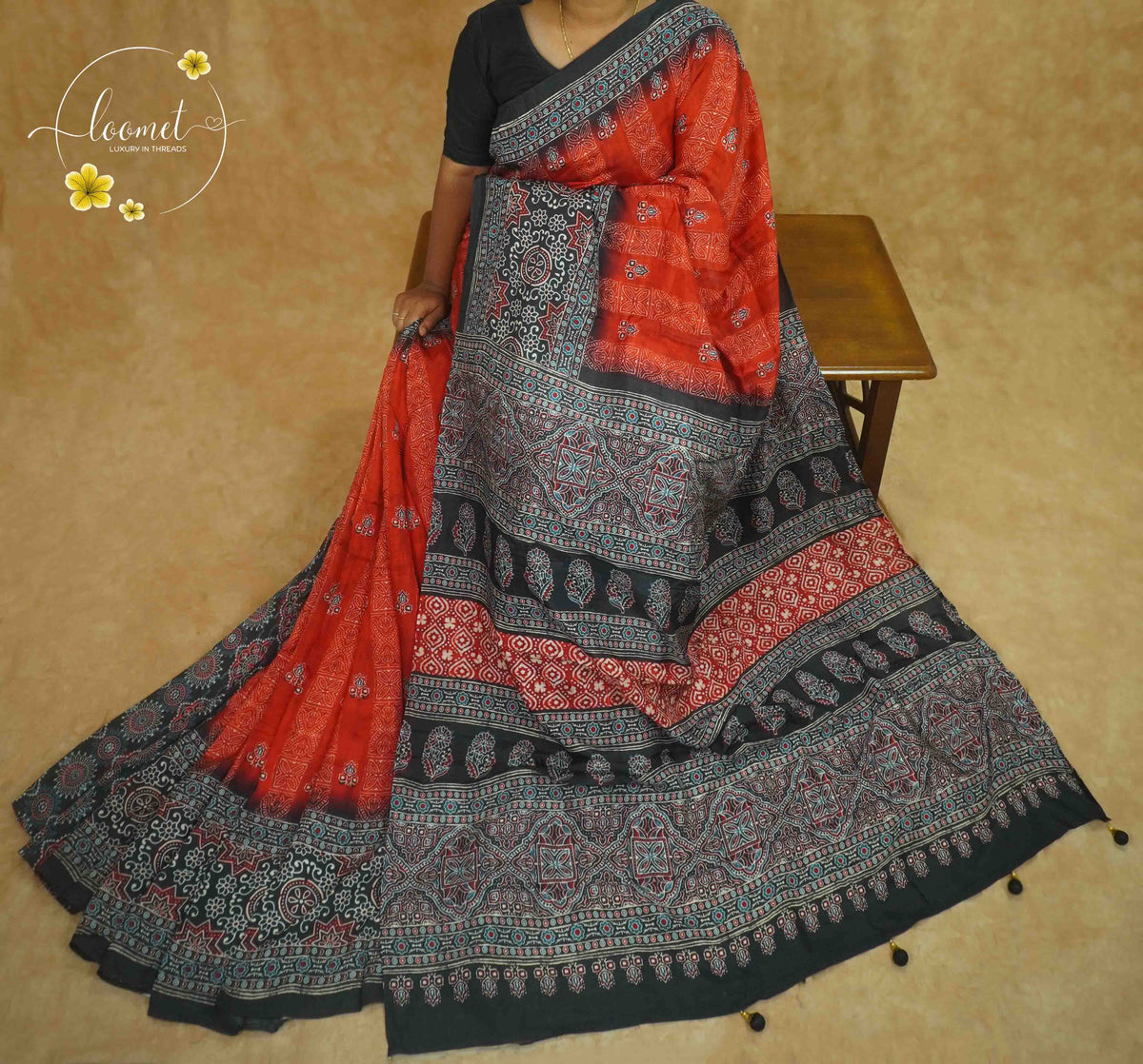APL8401 Terracotta & Charcoal Pure Dola Viscose saree with intricate geometric block prints and tassels.