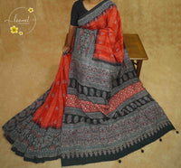 APL8401 Terracotta & Charcoal Pure Dola Viscose saree with intricate geometric block prints and tassels.