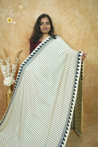 APL8606 Off-White Crepe Silk saree with vertical black pinstripes.