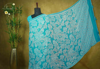 ARN1616 Cyan Blue Chiffon saree with all-over large floral prints.