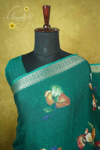 ARN21003 Emerald Green Georgette saree with multicolor floral bouquets.