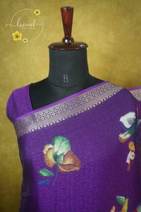 ARN21005 Purple Georgette saree with multicolour floral bouquets.