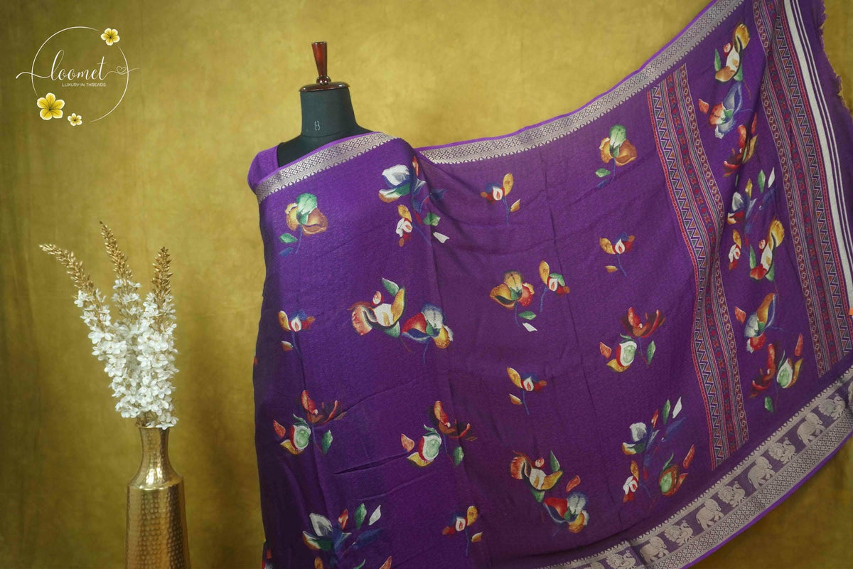 ARN21005 Purple Georgette saree with multicolour floral bouquets.