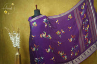 ARN21005 Purple Georgette saree with multicolour floral bouquets.