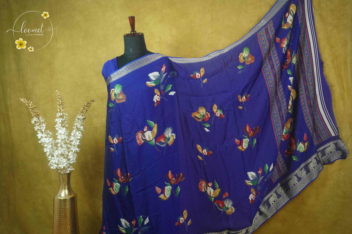ARN21006 Royal Blue Georgette saree with multicolor floral bouquets.