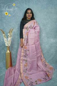 ARN2301 Pastel pink Kota cotton saree features floral vines with gold zari striped border.