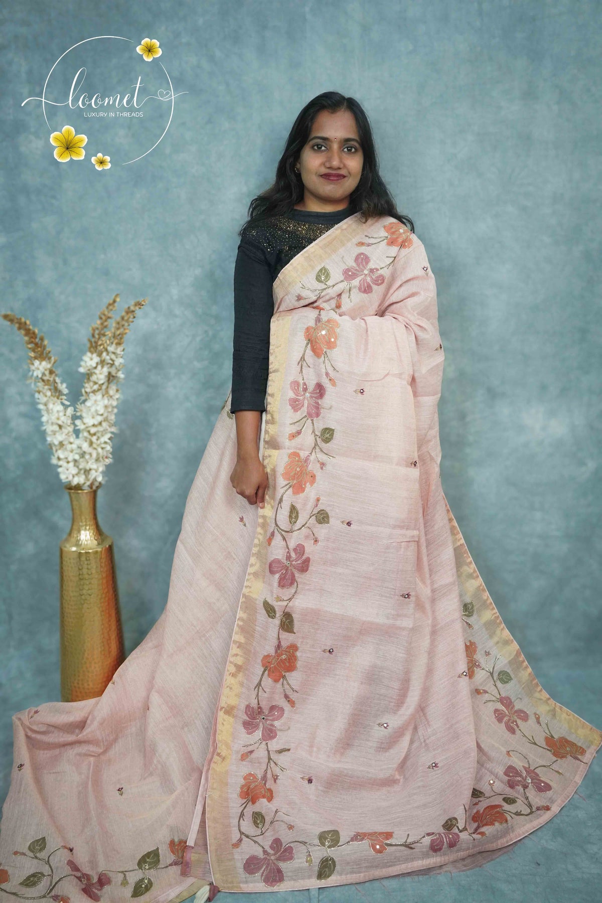 ARN2304 Blush Pink Kota cotton saree features floral vines with gold zari striped border.