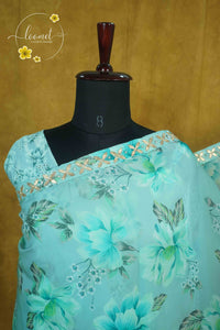 ARN2604 Aqua Blue Organza saree with large-scale floral print.