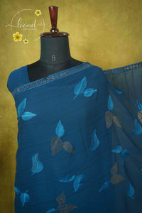 ARN3103 Teal Blue Jute Georgette saree with leaf motifs.