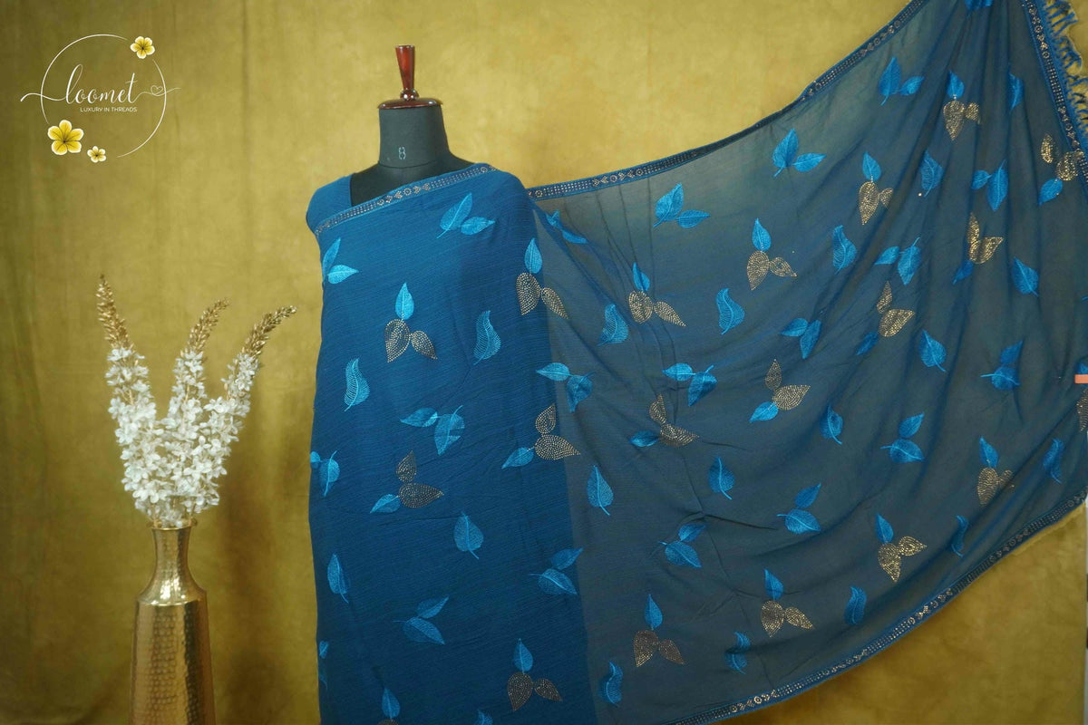 ARN3103 Teal Blue Jute Georgette saree with leaf motifs.