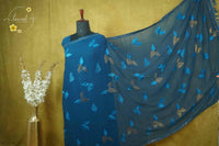 ARN3103 Teal Blue Jute Georgette saree with leaf motifs.