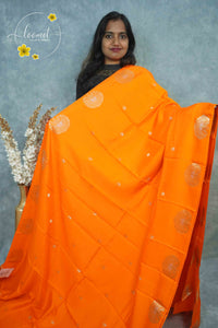 ARN3403 Orange Mysore silk saree with copper zari peacock buttas.