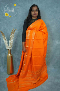 ARN3501 Orange Mysore Silk saree features floral and coin-shaped motifs.