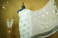 ARN4102 Off-white & teal blue Georgette saree with circular butta motifs.