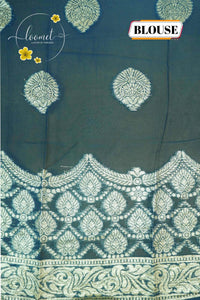 ARN4102 Off-white & teal blue Georgette saree with circular butta motifs.