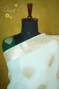 ARN4104 Off-white & deep forest green Georgette saree with circular butta motifs.