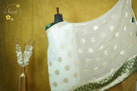 ARN4104 Off-white & deep forest green Georgette saree with circular butta motifs.