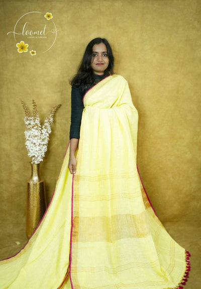 ASB2560 Bright lemon yellow saree with a textured body, featuring a vertical border of gold zari and multiple thin maroon/pink stripes.