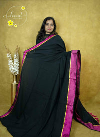 ASB25630 Jet Black & Rani Pink  Mul-Cotton saree with plain body pattern.