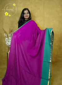 ASB25635 Magenta and Sea Green Mul-Cotton saree with plain body pattern.